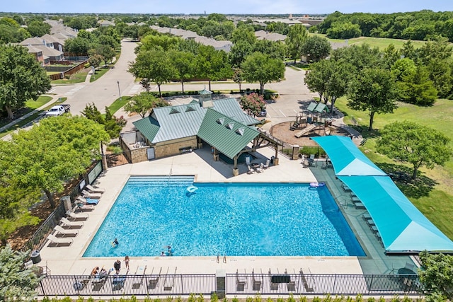 view of pool featuring fence