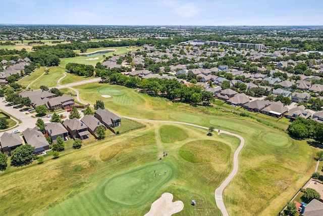 aerial view with golf course view and a residential view