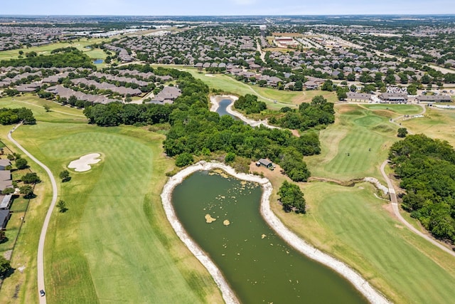 birds eye view of property with a water view and golf course view