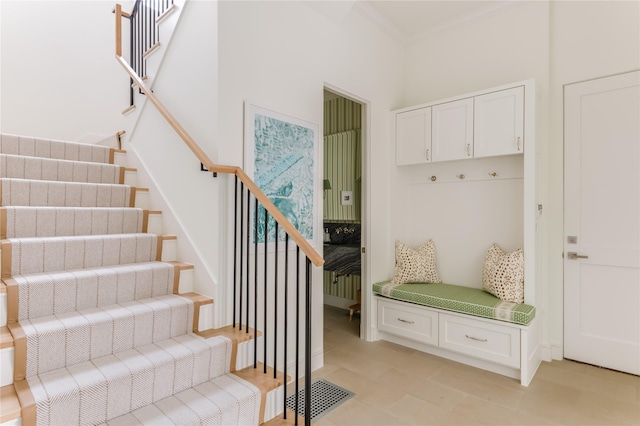 mudroom featuring ornamental molding