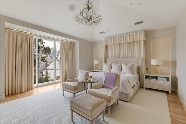 bedroom featuring lofted ceiling, visible vents, light wood-style flooring, an inviting chandelier, and access to outside