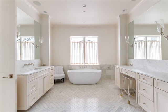 full bathroom with a soaking tub, a wainscoted wall, crown molding, vanity, and tile walls