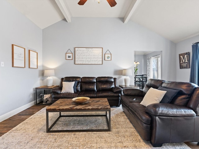 living room with a ceiling fan, lofted ceiling with beams, baseboards, and wood finished floors