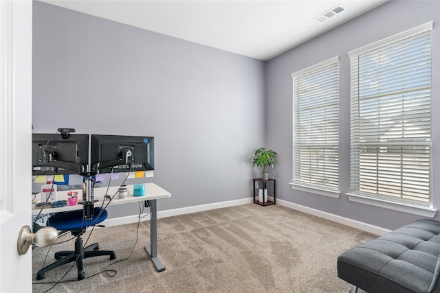 office area with carpet, visible vents, and baseboards