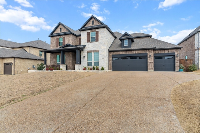 view of front of house with a garage, brick siding, a shingled roof, stone siding, and concrete driveway