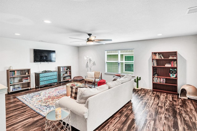 living area with recessed lighting, visible vents, ceiling fan, a textured ceiling, and wood finished floors