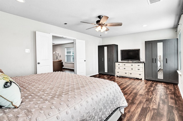 bedroom featuring ceiling fan, dark wood-style flooring, and recessed lighting