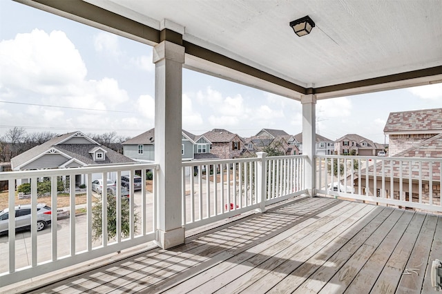 wooden deck with a residential view