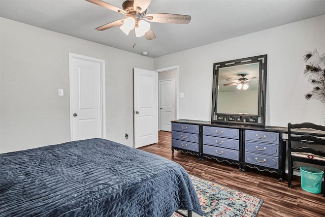 bedroom with a ceiling fan and dark wood-style flooring