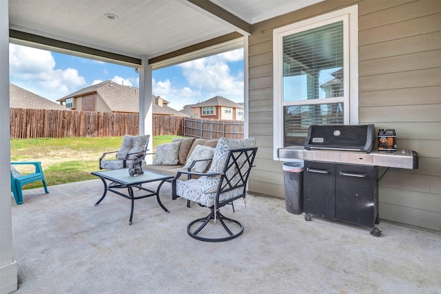 view of patio / terrace featuring fence, area for grilling, and an outdoor hangout area