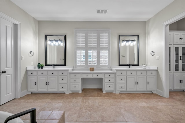 2204 Emerson Ln, Carrollton, TX 75010 - bathroom featuring tile patterned flooring, a garden tub, and baseboards