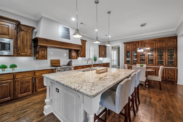 2204 Emerson Ln, Carrollton, TX 75010 - kitchen featuring a sink, built in appliances, ornamental molding, custom exhaust hood, and tasteful backsplash