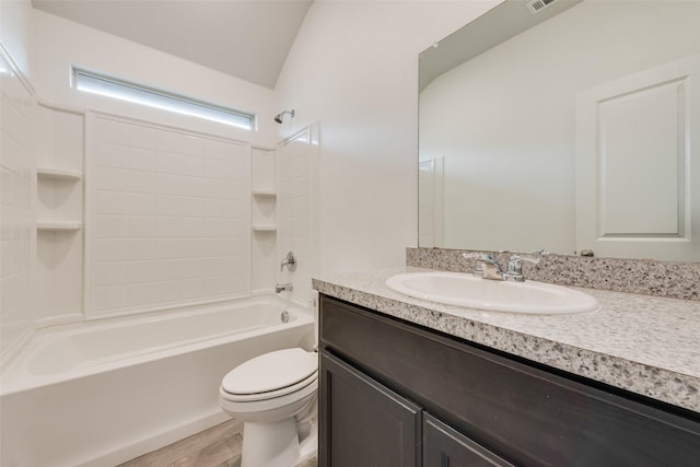 full bath with visible vents, toilet, vaulted ceiling, vanity, and  shower combination