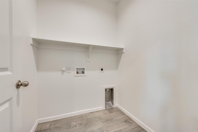 clothes washing area with laundry area, baseboards, hookup for a gas dryer, hookup for a washing machine, and hookup for an electric dryer