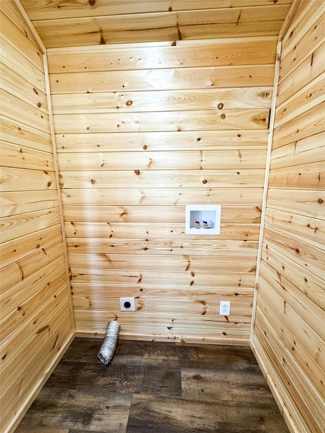 laundry room with hookup for a washing machine, hookup for an electric dryer, laundry area, dark wood-style flooring, and wood walls