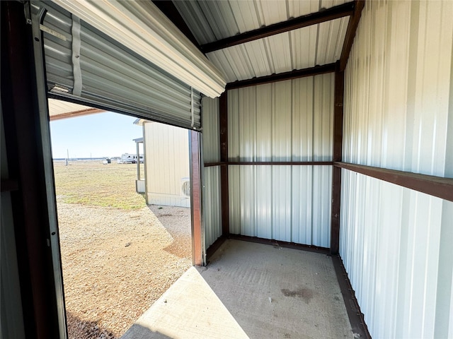 garage featuring metal wall