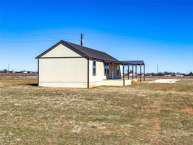 view of home's exterior with a yard