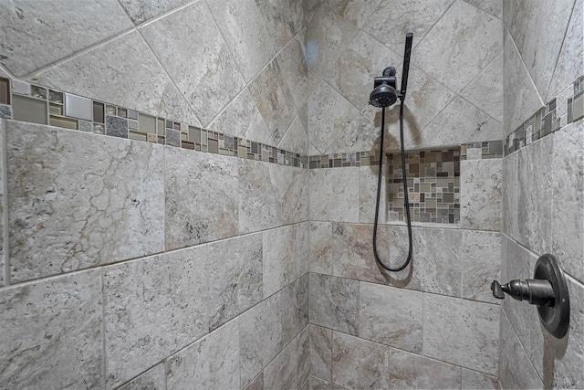 room details with a tile shower