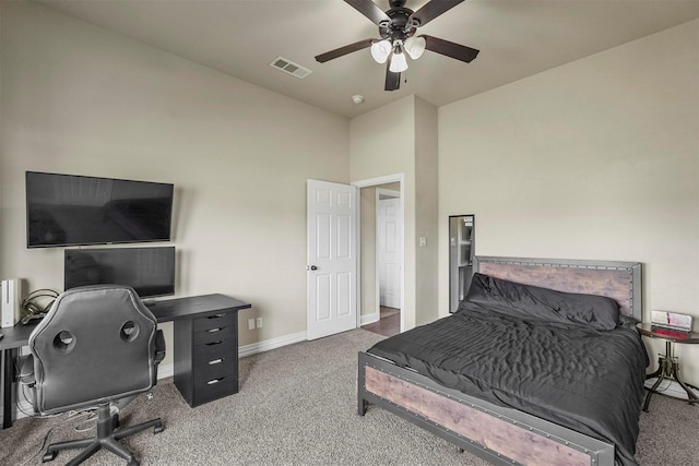 carpeted bedroom featuring baseboards, visible vents, and ceiling fan