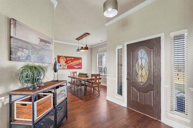 foyer featuring dark wood-style floors, baseboards, and ornamental molding