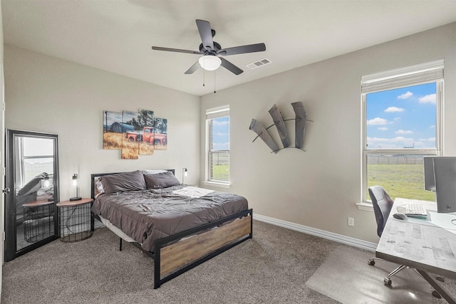 bedroom featuring a ceiling fan, carpet, visible vents, and baseboards