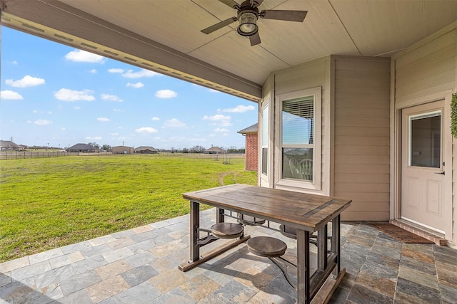 view of patio / terrace with outdoor dining space and a ceiling fan