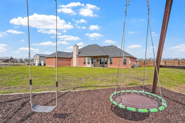 view of yard with a patio, a trampoline, and fence