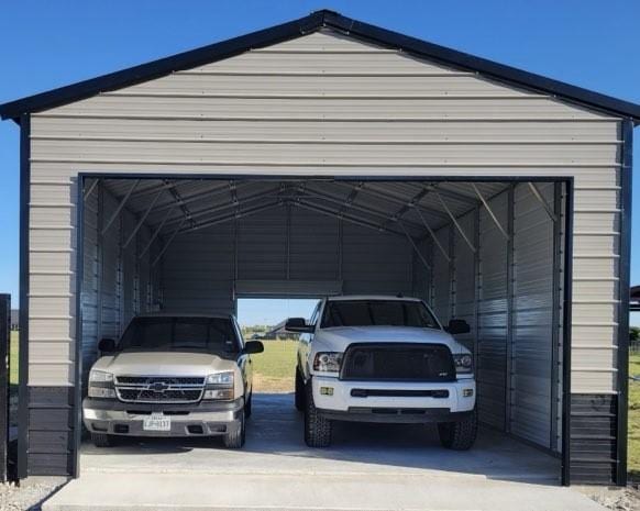 view of vehicle parking featuring a garage