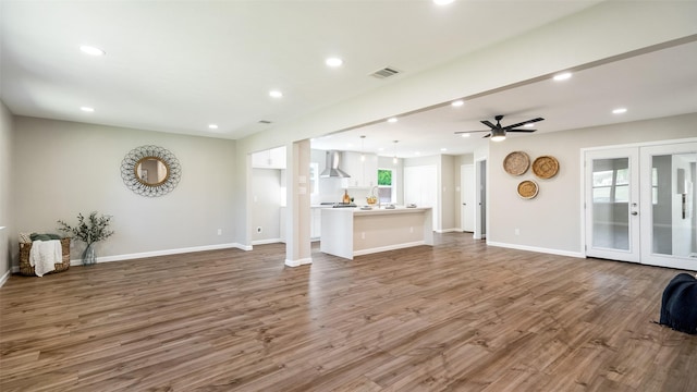 living room with recessed lighting, wood finished floors, a ceiling fan, baseboards, and french doors