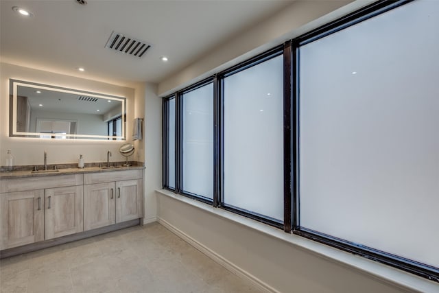 full bath with recessed lighting, visible vents, and a sink