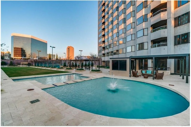 view of pool featuring a patio area