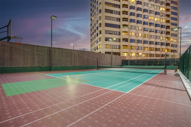 view of sport court featuring fence