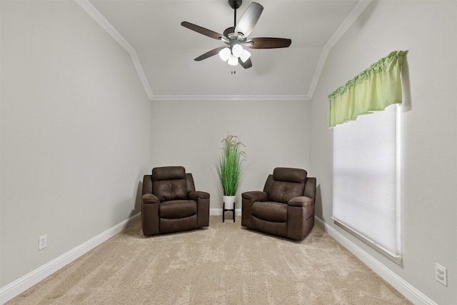 sitting room with carpet floors, plenty of natural light, crown molding, and a ceiling fan