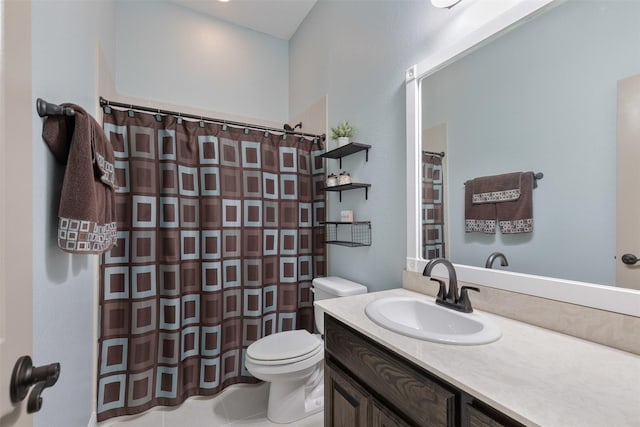 bathroom with toilet, curtained shower, tile patterned floors, and vanity