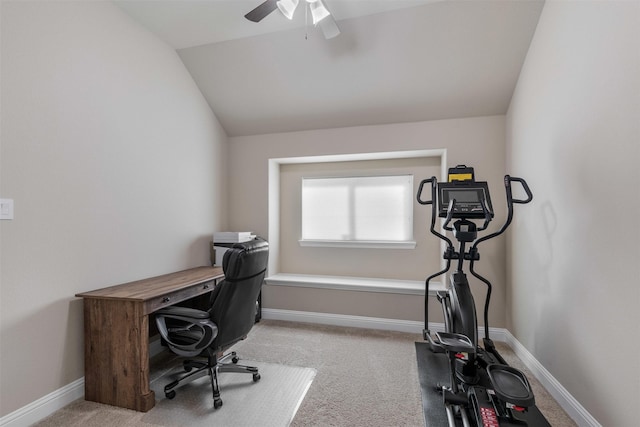 carpeted home office with vaulted ceiling, a ceiling fan, and baseboards