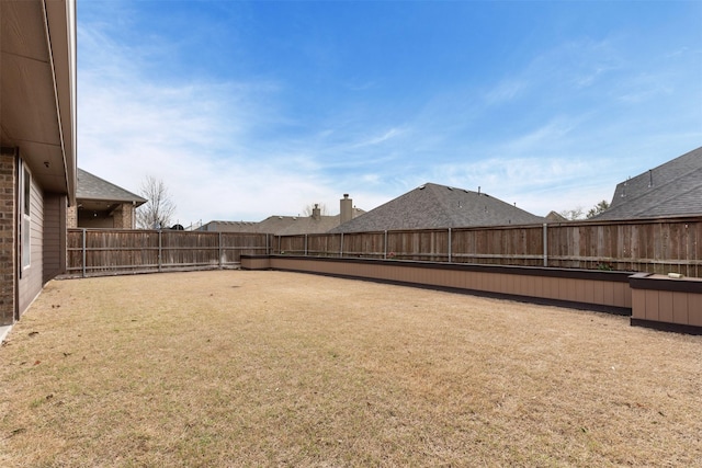 view of yard featuring a fenced backyard