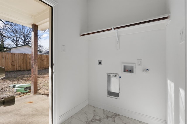 washroom with gas dryer hookup, hookup for an electric dryer, washer hookup, baseboards, and marble finish floor