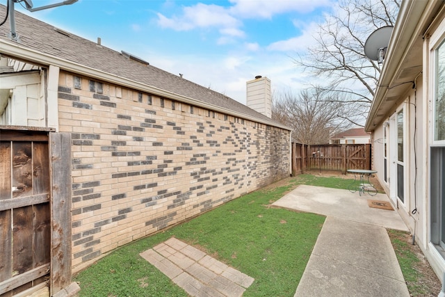 view of yard featuring a patio area and fence