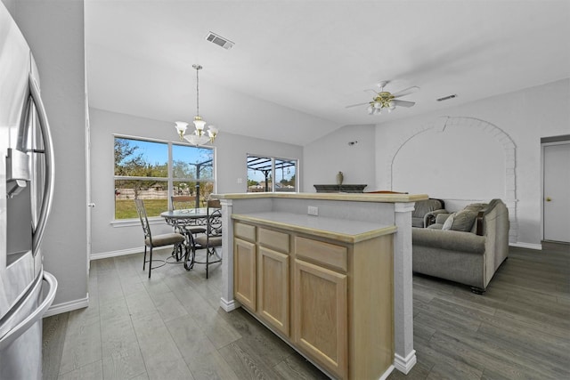 kitchen featuring visible vents, light brown cabinetry, wood finished floors, open floor plan, and stainless steel fridge with ice dispenser