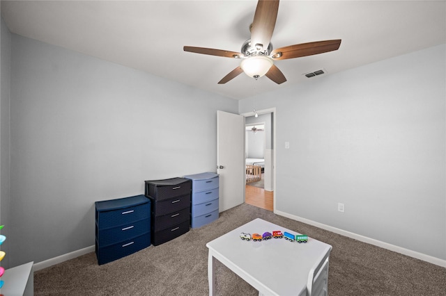 recreation room with carpet floors, baseboards, and visible vents