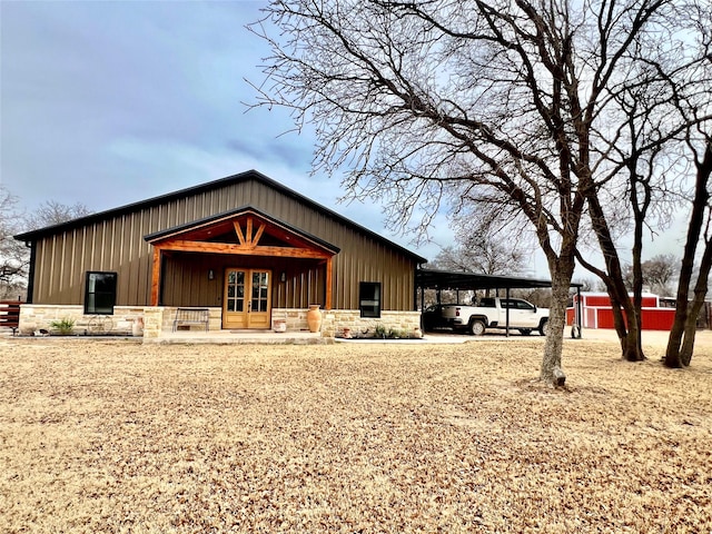 view of outbuilding with an attached carport and french doors