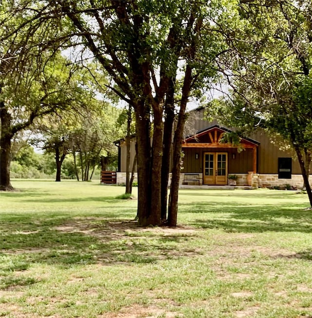 view of yard featuring french doors