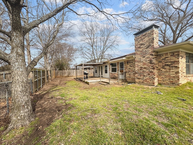 view of yard featuring a patio and a fenced backyard