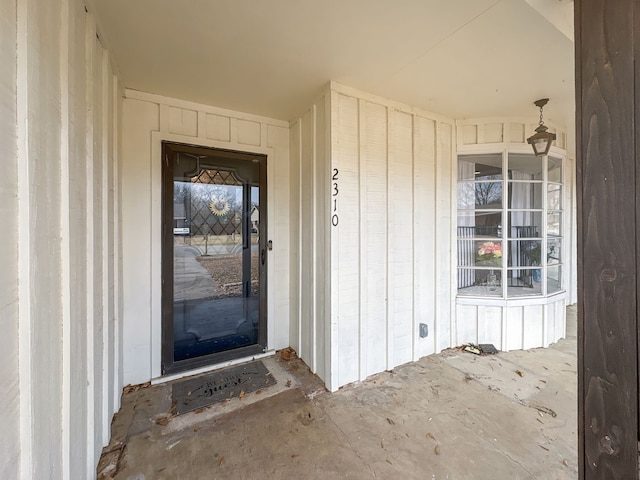 property entrance with board and batten siding