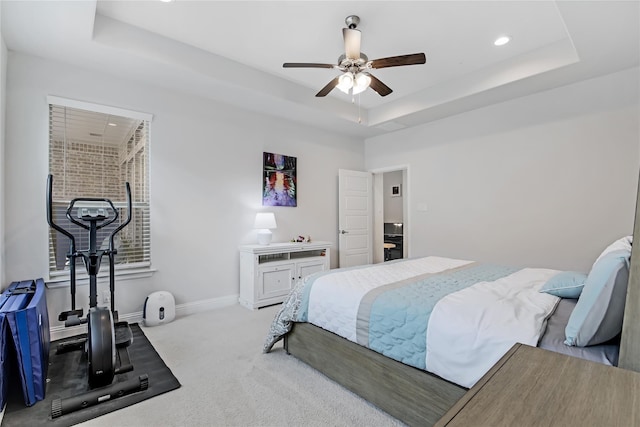 carpeted bedroom featuring recessed lighting, a raised ceiling, ceiling fan, and baseboards