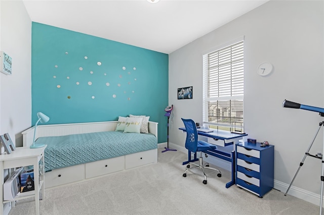 bedroom featuring carpet flooring and baseboards