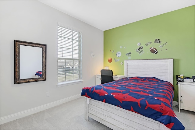 carpeted bedroom featuring baseboards