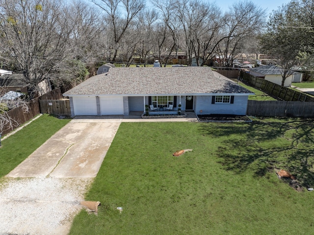 single story home with a porch, brick siding, fence, concrete driveway, and a front lawn