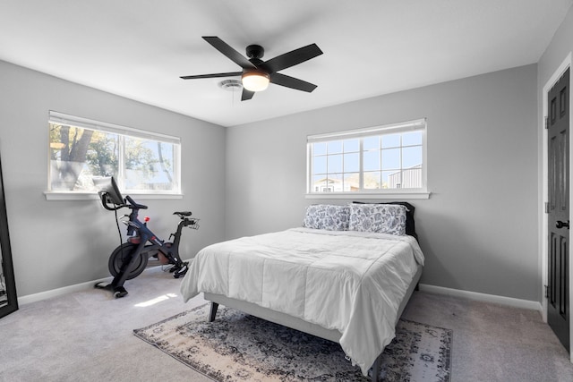 carpeted bedroom featuring a ceiling fan and baseboards