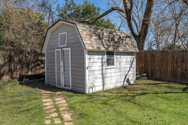 view of shed featuring a fenced backyard